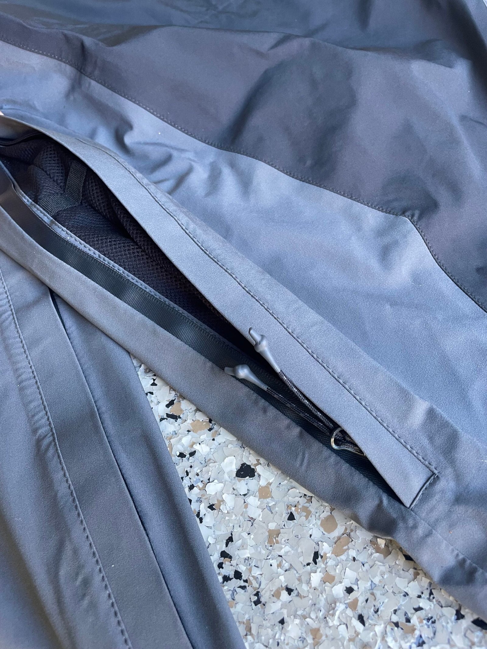 gray baggy snowpants with large leg vents for cooling