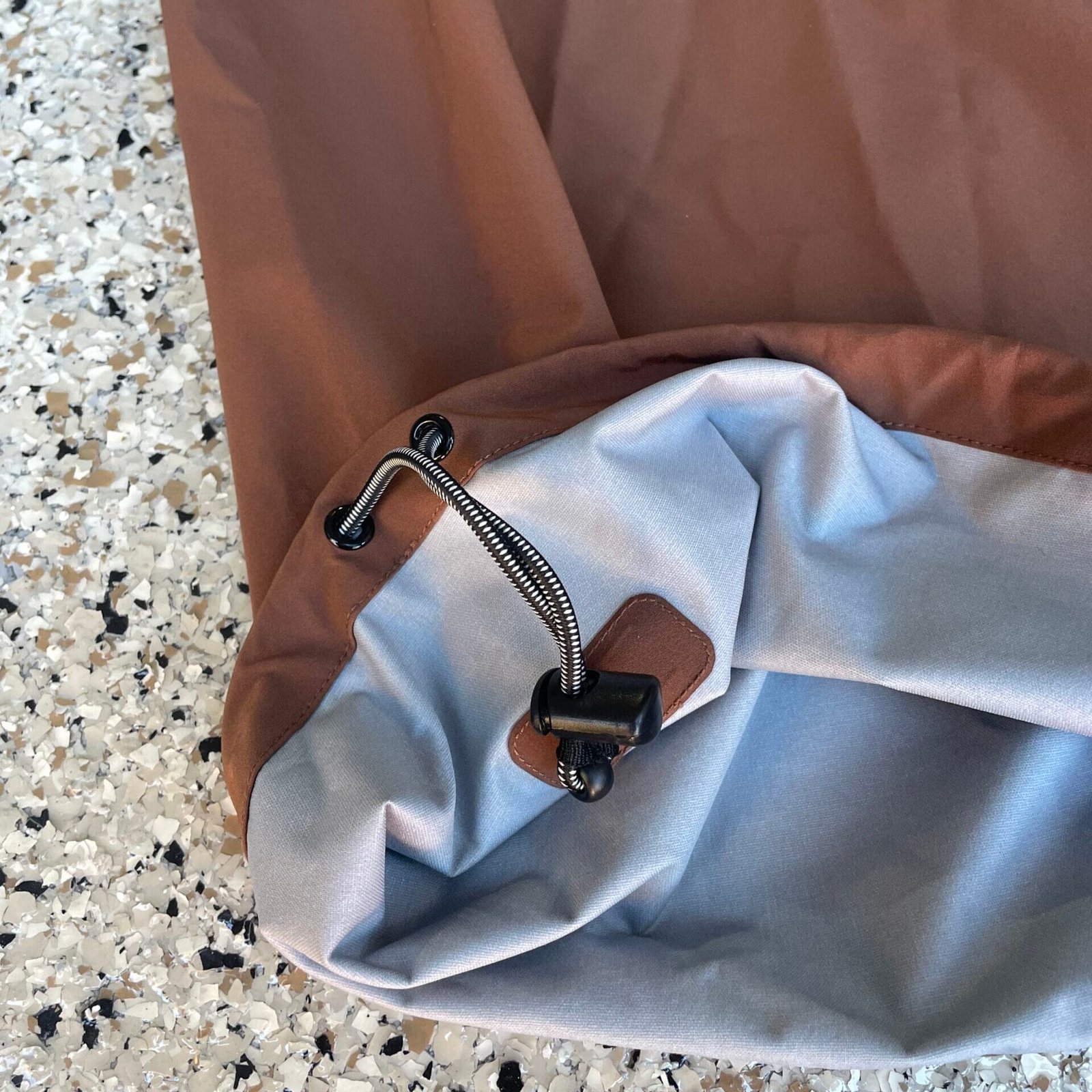 technical ankle cinches on brown baggy snowpants